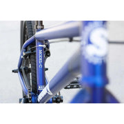 Close-up of blue SUNDAY MODEL C 24" complete BMX bike frame and rear wheel with visible MODEL C branding