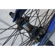 Close-up of black Sunday Model C bike hub and spokes on blue 24" BMX wheel
