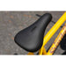 Black BMX saddle with embossed Sunday Bikes logo on matte mustard Sunday EX Arteaga frame