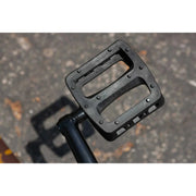 Close-up of black Odyssey plastic bike pedal on Sunday EX ARTEAGA 20" BMX complete bike pedal crank arm