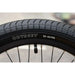 Close-up of Odyssey 20-inch BMX bike tire with 35-65 PSI pressure range on Sunday EX Arteaga complete bike rim