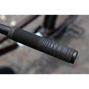 Close-up of black SUNDAY EX ELSTRAN BMX bike handlebar grip with textured pattern.