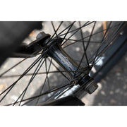 Close-up of black Sunday EX Elstran bike front hub with spokes and axle details