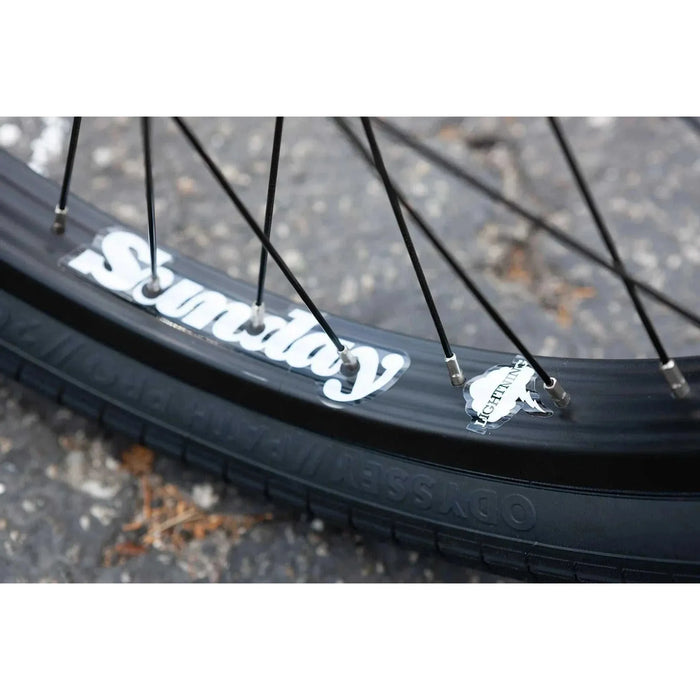 Close-up of Sunday EX Elstran BMX bike wheel with black Odyssey Path Pro tire and Sunday Lightning rim.