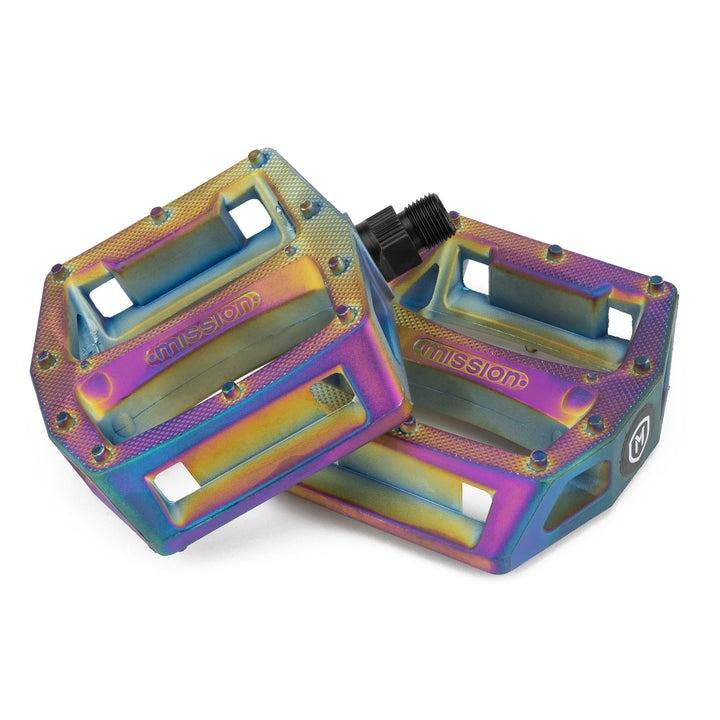 Colorful MISSION IMPULSE PEDALS with 12 traction pins per side and knurled nylon composite body for superior bike grip