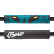 Reversible Odyssey barpad slugger with colorful tie-dye pattern on one side and black quilted design with white embroidered logo on the other side