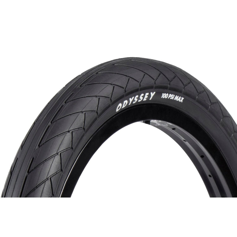 Odyssey Dugan blackwall tire with tread pattern and 100 PSI max pressure label