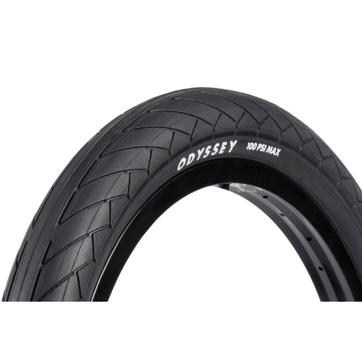 Odyssey Dugan blackwall tire with tread pattern and 100 PSI max pressure label