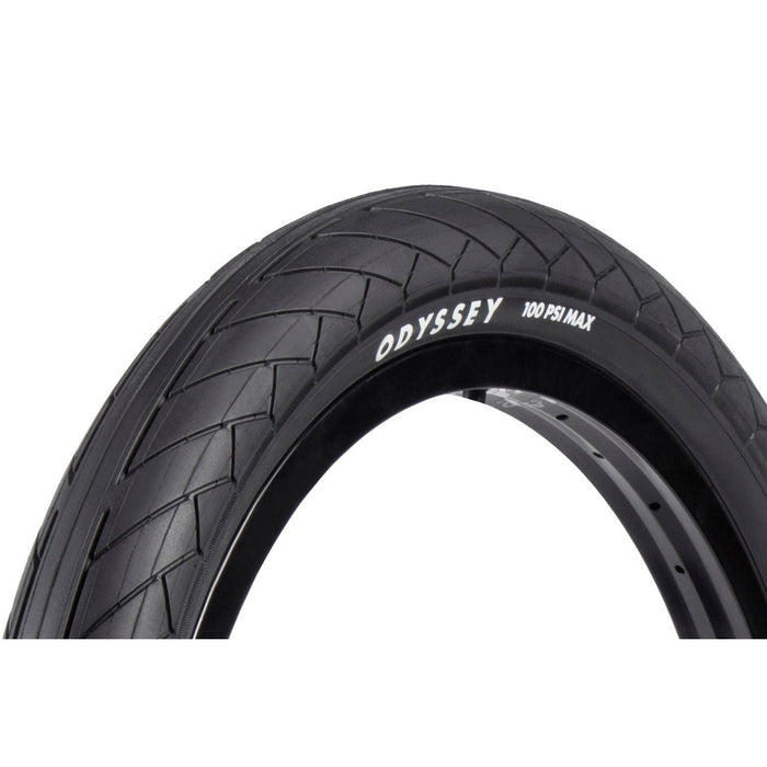 Odyssey Dugan blackwall tire with tread pattern and 100 PSI max pressure label