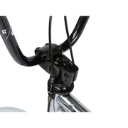Close-up of the black handlebar and stem assembly on the RADIO ASTRON FS complete bike.