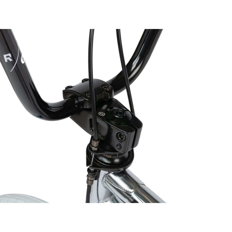 Close-up of the black handlebar and stem assembly on the RADIO ASTRON FS complete bike.