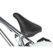 Close-up of black RADIO ASTRON FS COMPLETE BIKE seat and polished chrome frame.