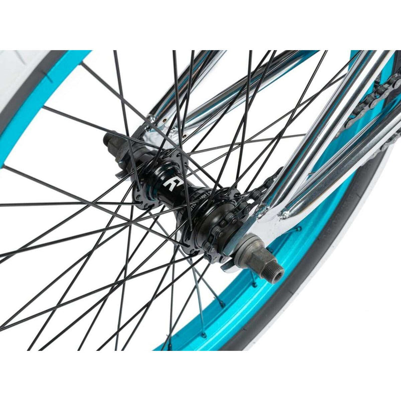 Close-up of the rear wheel hub and spokes on the RADIO ASTRON FS COMPLETE BIKE with blue rim and black components.