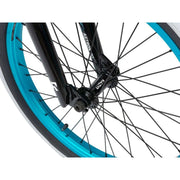 Close-up of front wheel and fork of RADIO ASTRON FS COMPLETE BIKE with blue rim and black spokes