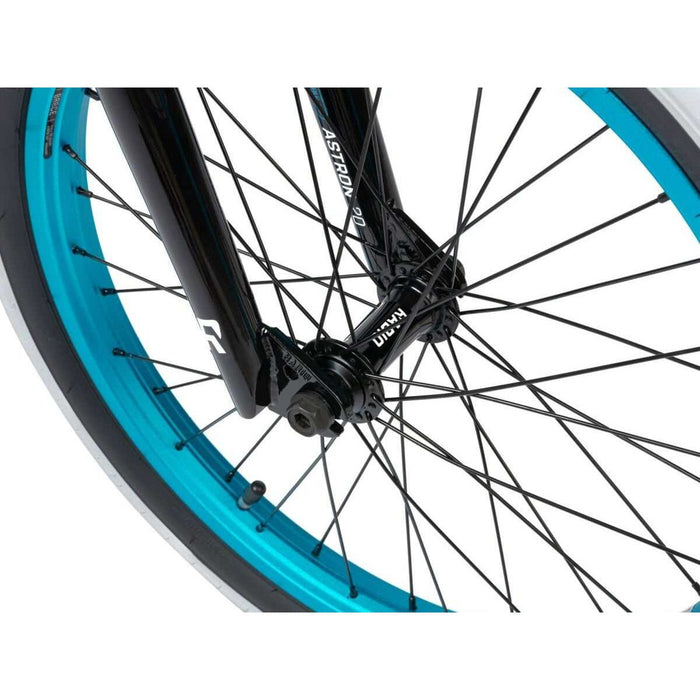 Close-up of front wheel and fork of RADIO ASTRON FS COMPLETE BIKE with blue rim and black spokes