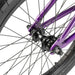 Close-up of the rear wheel hub and purple frame of the RADIO DARKO bike showing spokes and tire details