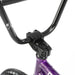 Close-up of Radio Darko bike black handlebars and stem with purple frame front section
