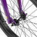 Close-up of the front wheel and fork of the RADIO DARKO bike in purple with black spokes and tire