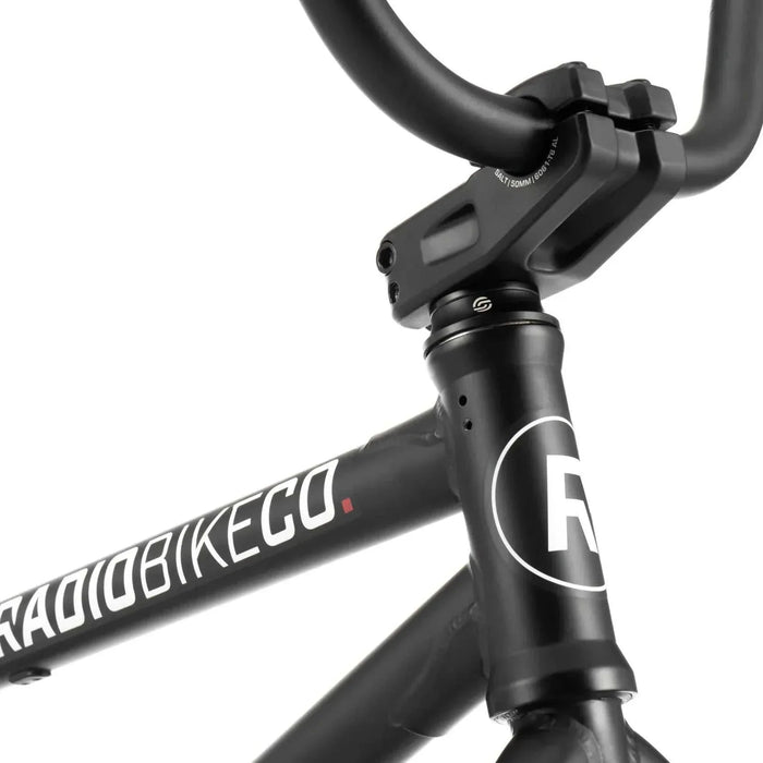 Close-up of the black RADIO DARKO bike frame and handlebar stem with logo detailing