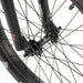 Close-up of RADIO DARKO bike front wheel hub and spokes with black rim and tire