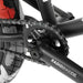 Close-up of RADIO DARKO bike black crankset and chainring with chain and tire details