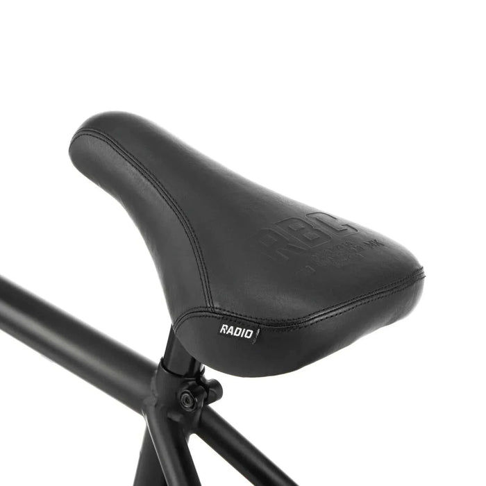 Close-up of black padded seat and frame detail on RADIO DARKO bike