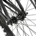 Close-up of the rear hub and spokes on the RADIO DARKO bike with black frame and Salt hubs.