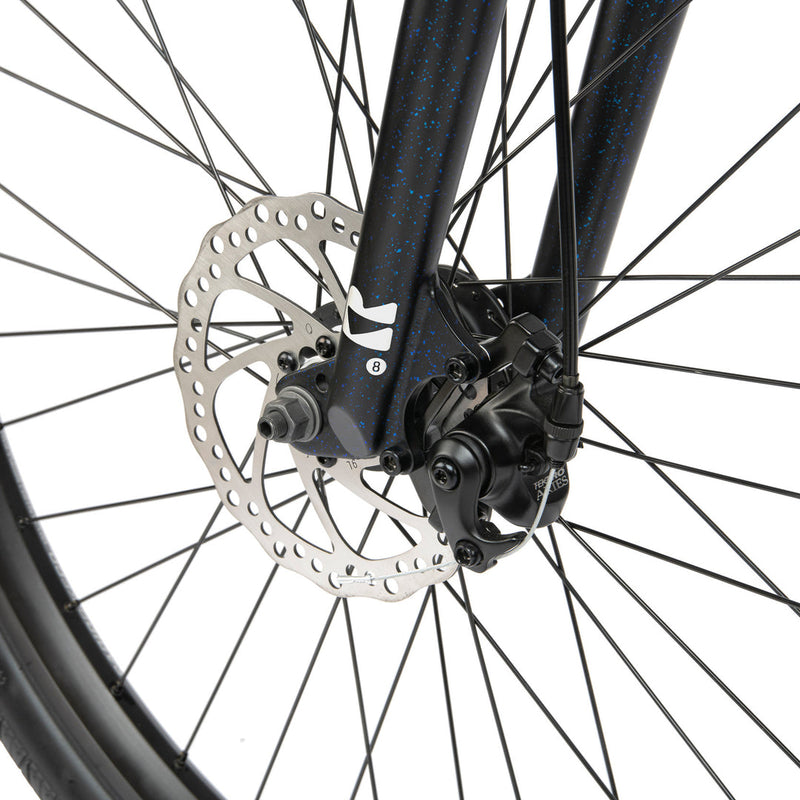 Close-up of the front disc brake and wheel of a black Radio LEGION 26 complete bike with 2.2" tires and alloy fork.