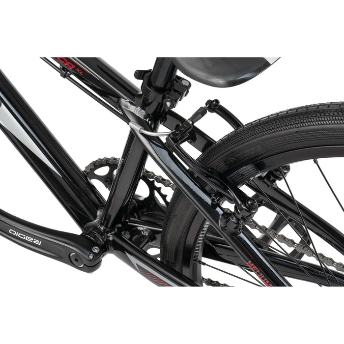 Close-up of the black Radio Raceline Helium Cruiser 24 complete bike frame and rear wheel components including chain, brake, and tire.