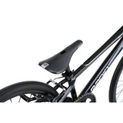 Close-up of RADIO RACELINE XENON Expert complete bike black frame with saddle, rear tire, and brake system details