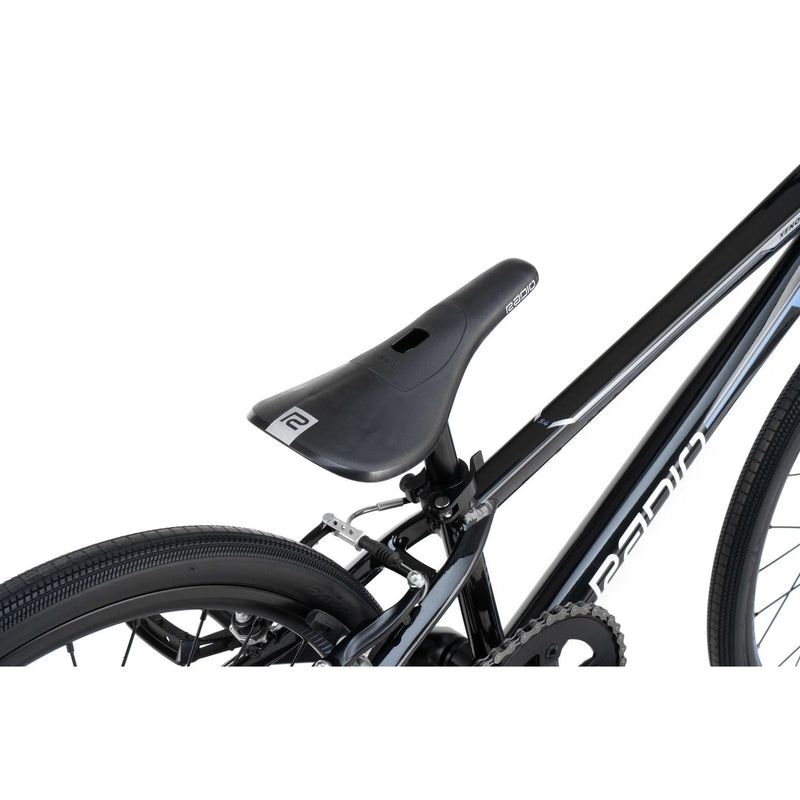 Close-up of RADIO RACELINE XENON Expert complete bike black frame with saddle, rear tire, and brake system details