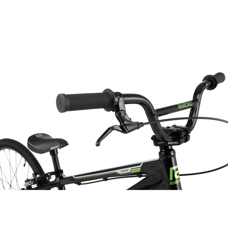 Close-up of RADIO RACELINE XENON JUNIOR black junior bike handlebars with brake lever and saddle details