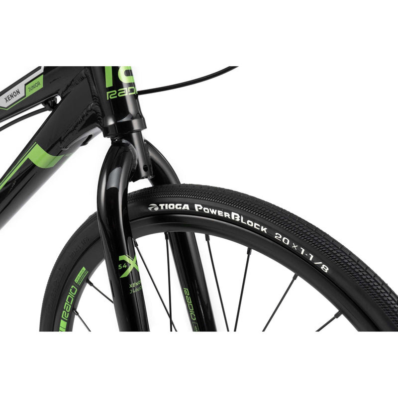 Close-up of the front wheel and fork of RADIO RACELINE XENON JUNIOR bike with Tioga PowerBlock tire and black alloy frame details