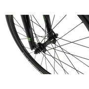 Close-up of RADIO RACELINE XENON JUNIOR front wheel with black alloy hub, spokes, and TIOGA tire.