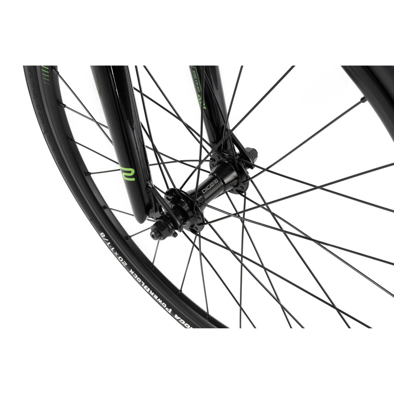 Close-up of RADIO RACELINE XENON JUNIOR front wheel with black alloy hub, spokes, and TIOGA tire.