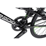 Close-up of RADIO RACELINE XENON JUNIOR black alloy bike crankset, chain, and rear wheel with green accents