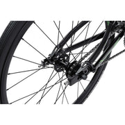 Close-up of rear wheel and disc-brake-ready dropout of RADIO RACELINE XENON JUNIOR bike with black Alloy frame and chain drivetrain