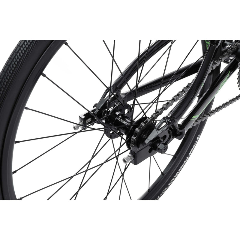 Close-up of rear wheel and disc-brake-ready dropout of RADIO RACELINE XENON JUNIOR bike with black Alloy frame and chain drivetrain