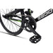 Close-up of RADIO RACELINE XENON JUNIOR bike black crankset, chain, and pedal with 20-inch tire and alloy frame details