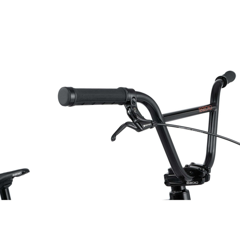 Close-up of Radio Raceline Xenon PRO bike handlebar with brake lever and grip in black finish