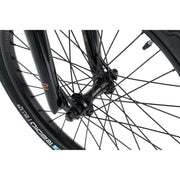 Close-up of the front wheel hub and fork of the Radio Raceline Xenon PRO bike featuring black Oxygen tire and Argon PRO rim with disc-brake ready dropout.