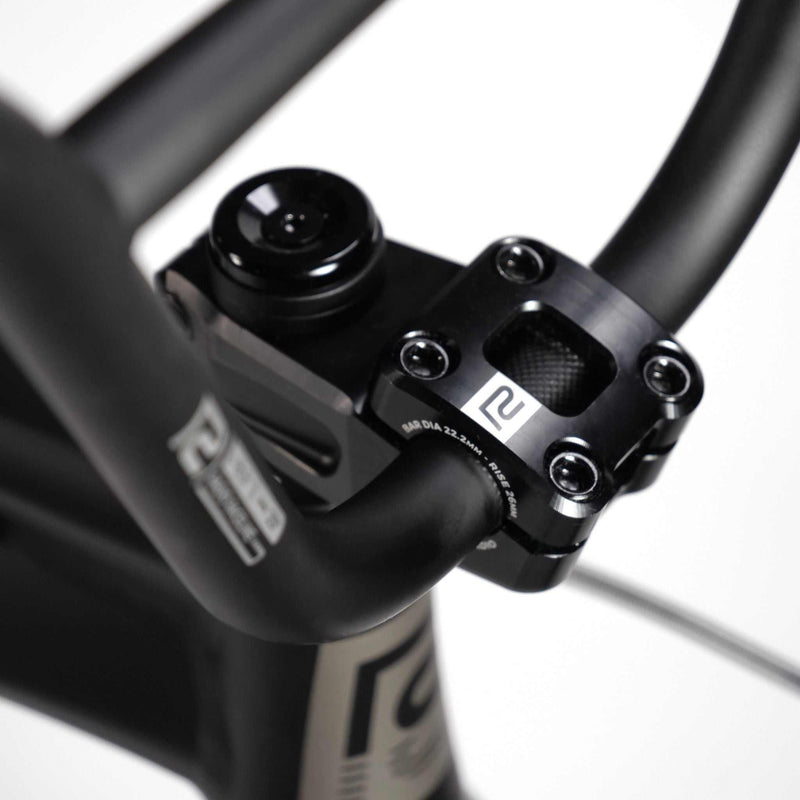 Close-up of black RADIO RACELINE QUARTZ PRO 20" bike handlebar and stem with logo details