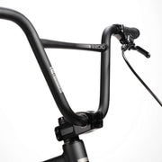 Close-up of RADIO RACELINE QUARTZ PRO bike black handlebar with brake lever and grip against white background