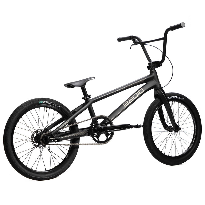 Black RADIO RACELINE QUARTZ PRO 20" BMX bike with alloy frame, carbon fork, hydraulic disc brakes, and tubeless ready Oxygen tires