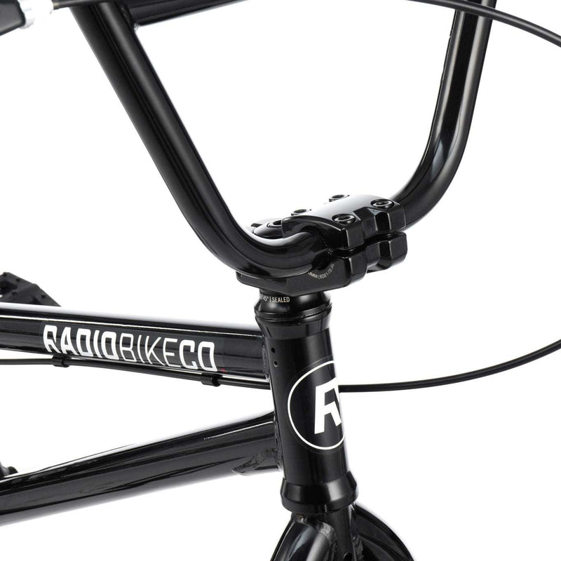 Close-up of black RADIO SAIKO 20 BMX bike handlebar and frame with logo detail
