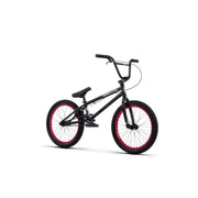 Black RADIO SAIKO 20 BMX bike with red rims and 20-inch wheels designed for nimble, responsive riding