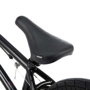 Close-up of the black saddle and rear frame of the Radio Saiko 20 complete bike.