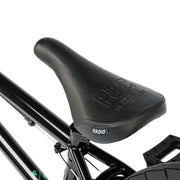 Close-up of black seat on RADIO SAIKO 20 complete 20-inch BMX bike with sleek frame and pedals.