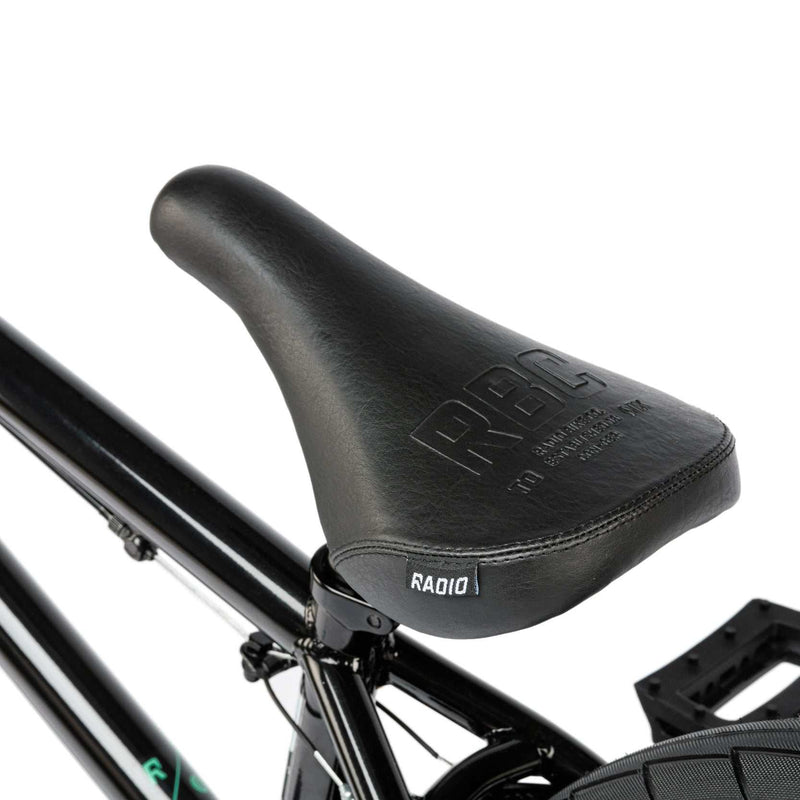 Close-up of black seat on RADIO SAIKO 20 complete 20-inch BMX bike with sleek frame and pedals.