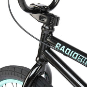 Close-up of the black RADIO SAIKO 20 bike frame and front wheel with light blue rim and tire.
